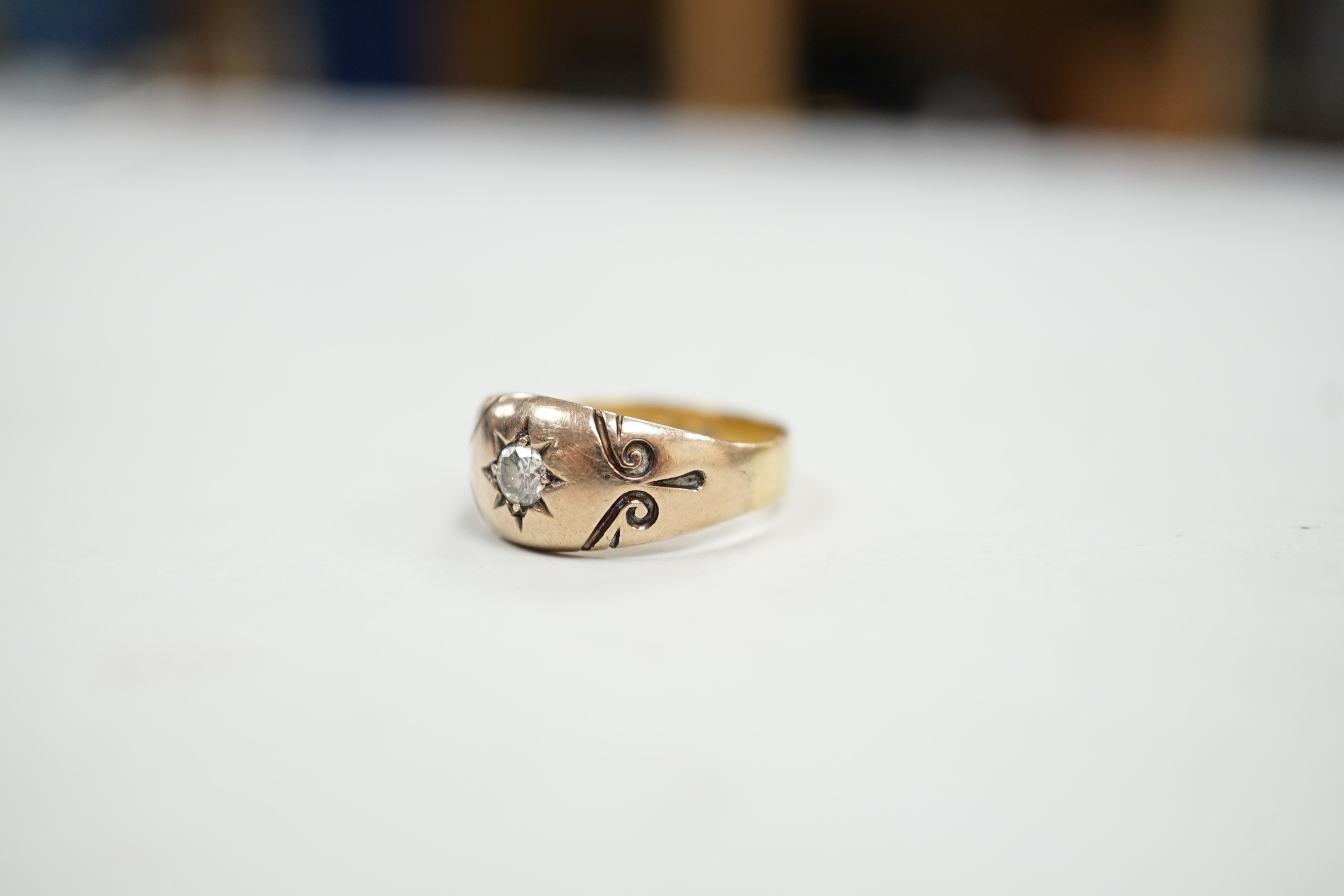 A Victorian 18ct gold and gypsy set solitaire diamond ring, size O, gross weight 3.9 grams.